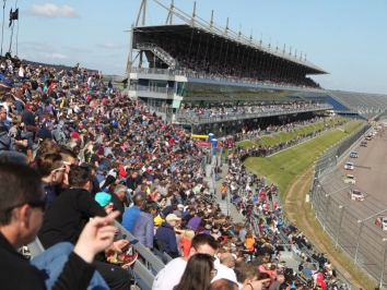 Gordon Shedden leads the field past the packed Rockingham grandstands